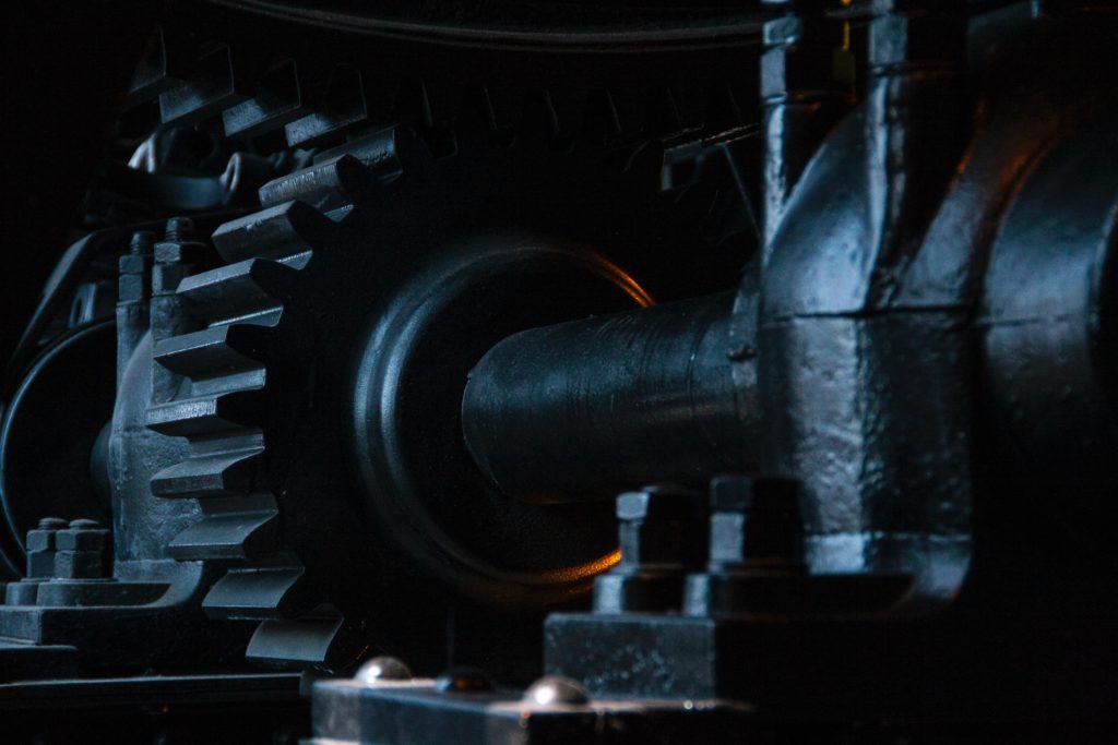 close-up photography of black metal gears